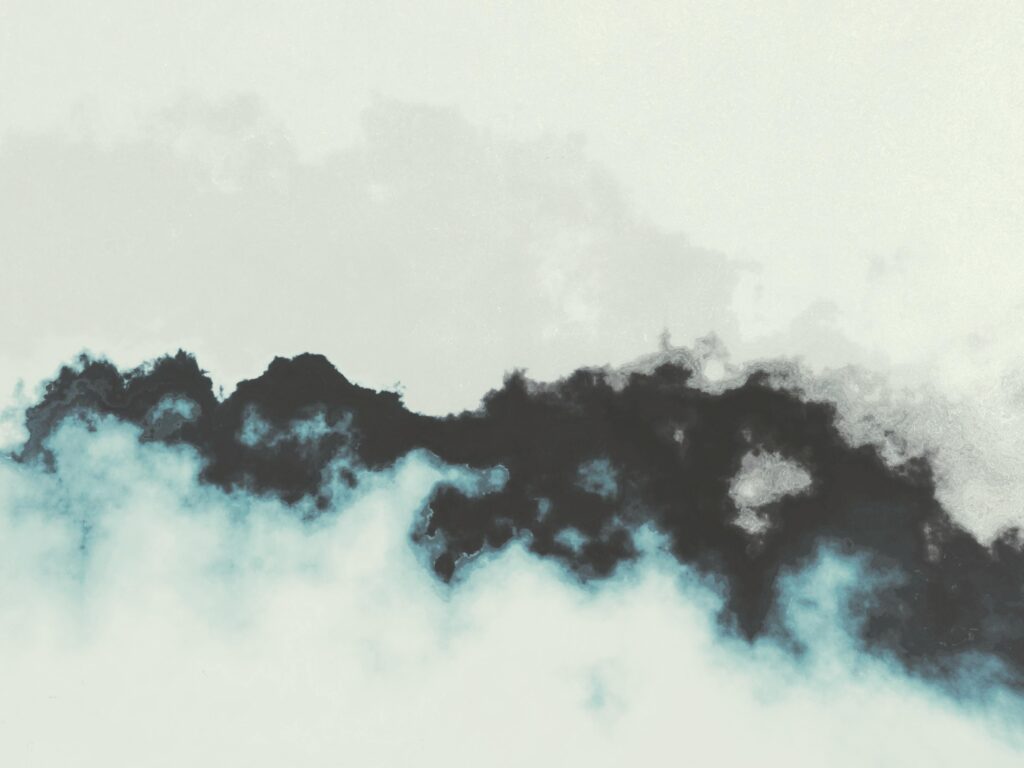 Abstract ink cloud formations on a white background, evoking creativity and modern art.