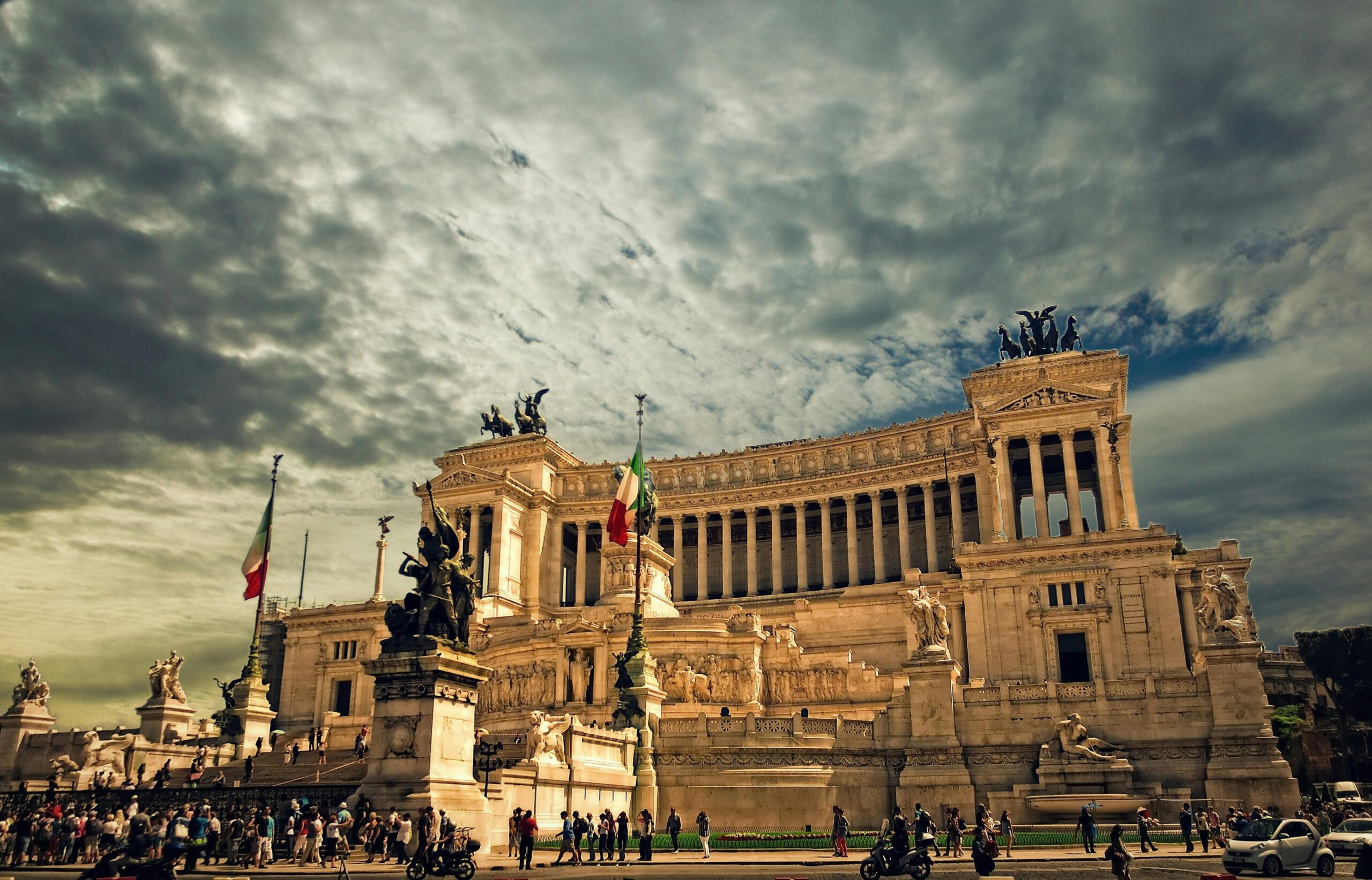 Stunning view of the Victor Emmanuel II Monument in Rome under dramatic skies.